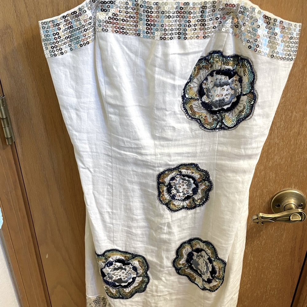 Woman’s white dress with sequin details